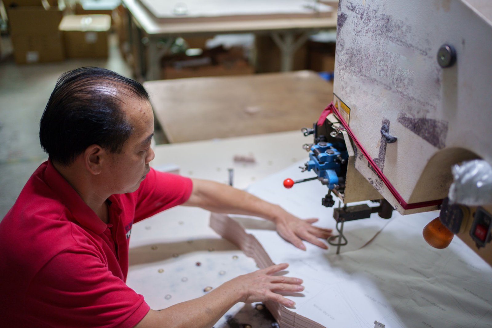 Worker cutting material with electric saw