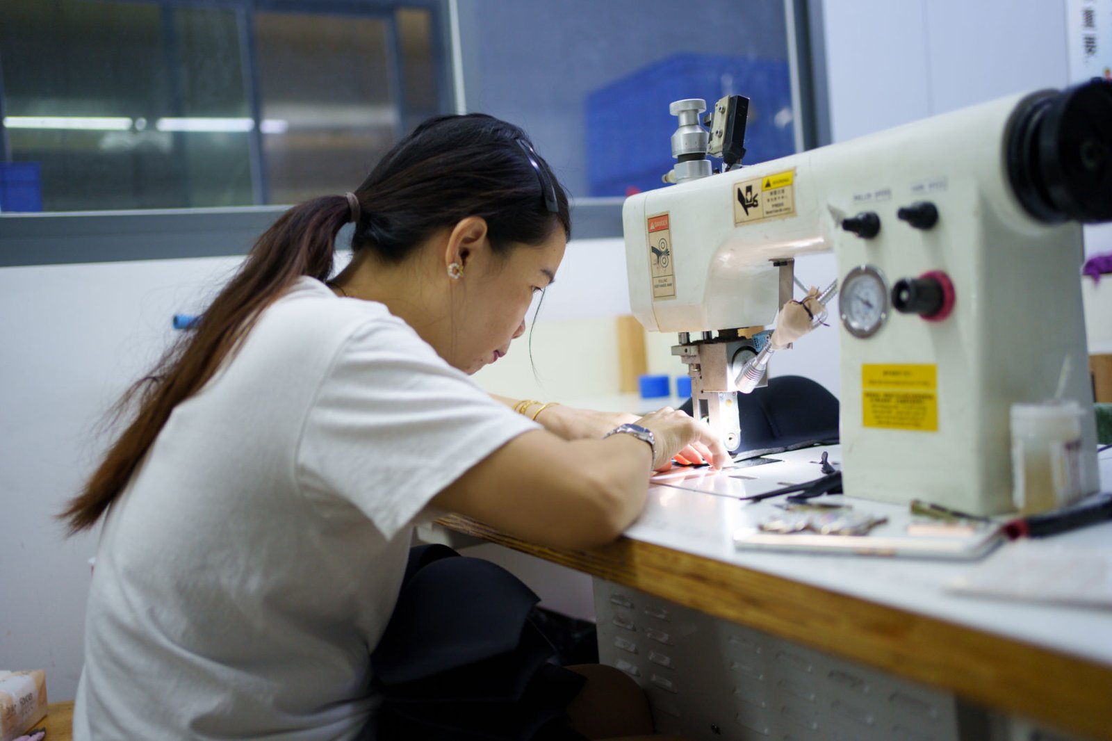 Female seamstress in garment factory